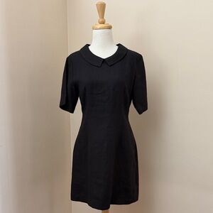 50’s style Peter Pan color black mini dress.